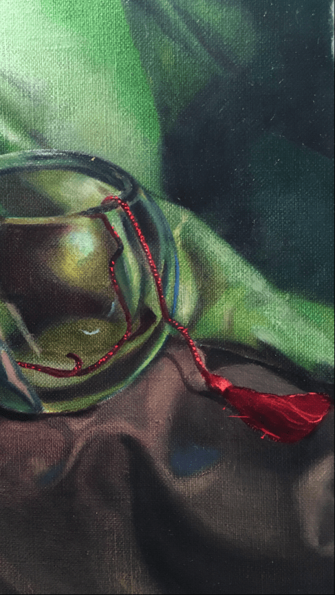 green-cloth-red-tassel